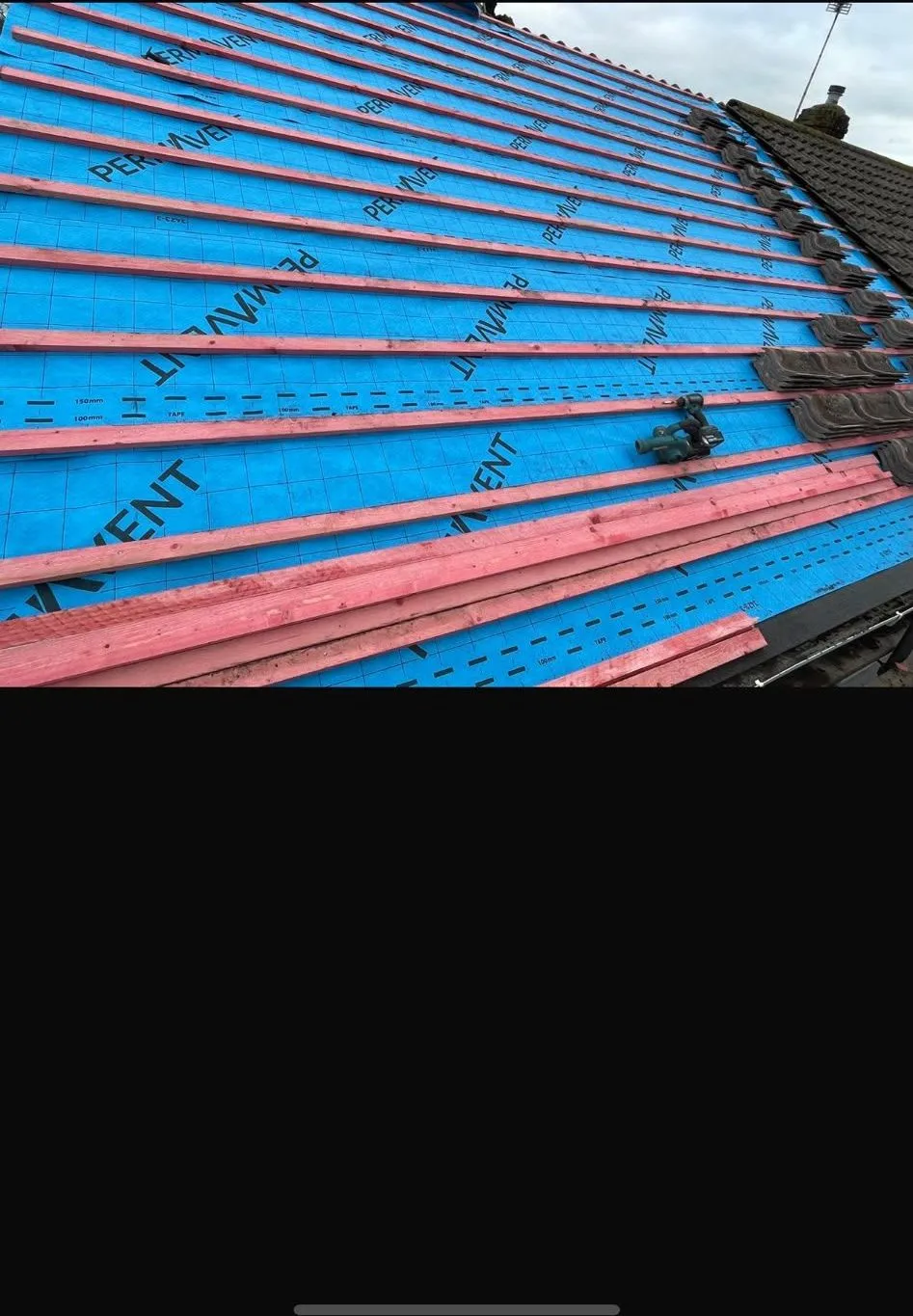 New breathable membrane and battens going on during a re-roof
