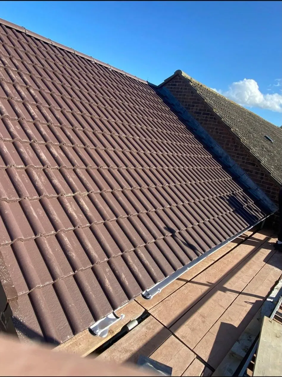 Newly tiled roof with new guttering fitted